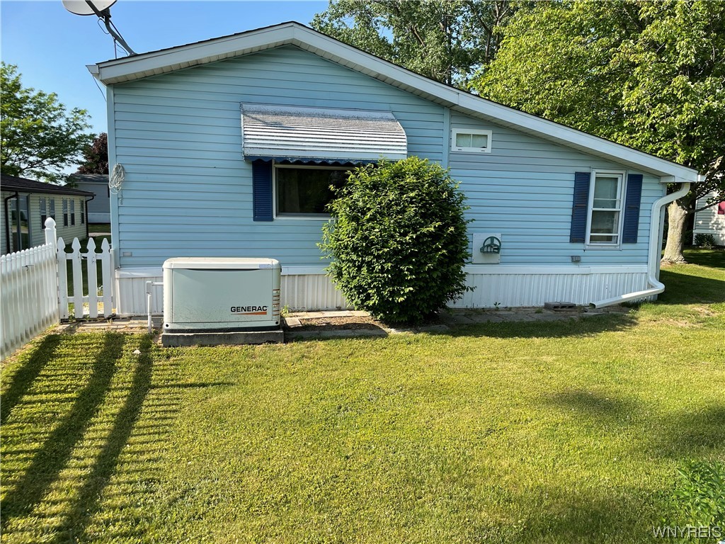 3926 Lockport Olcott Road, Unit 108 Lockport, NY 14094 - Photo 2 of 19 Rear of home with generator