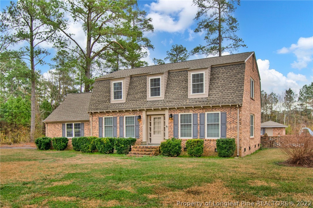 1537 Rice Road Orrum, NC 28369 - Photo 1 of 31 a front view of a house with a garden