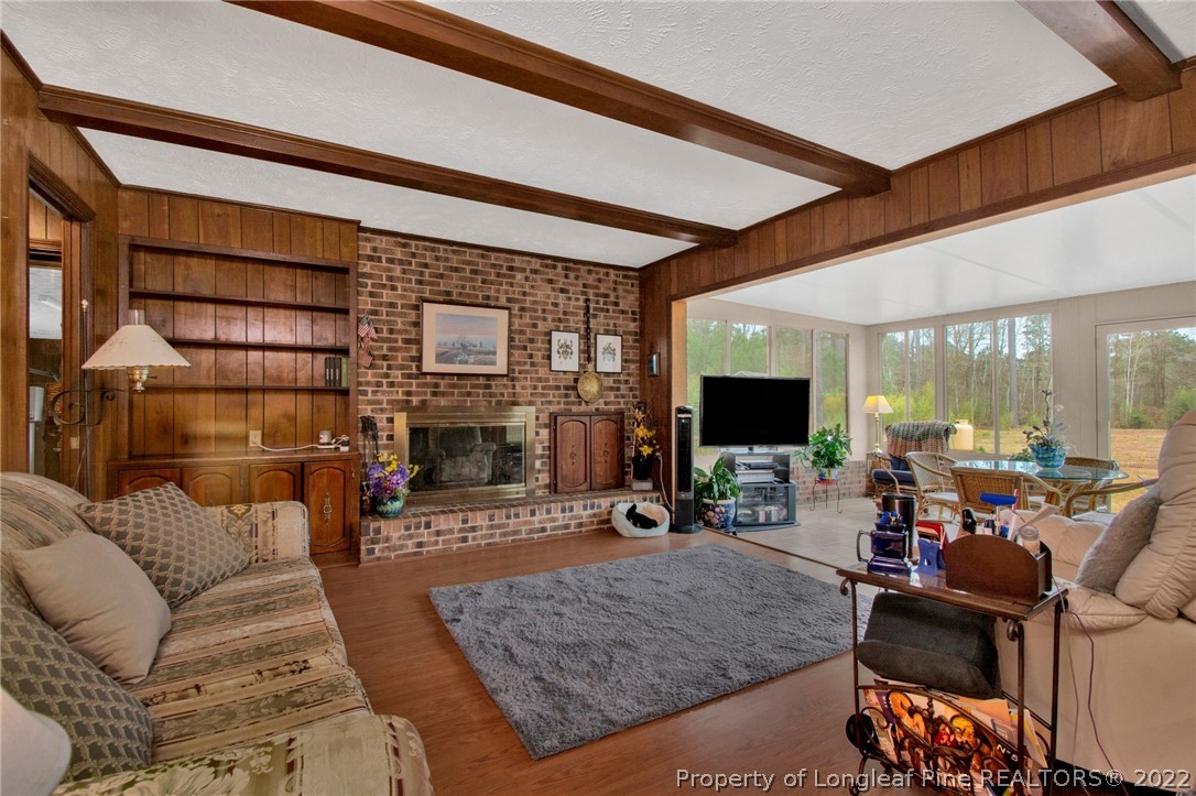 1537 Rice Road Orrum, NC 28369 - Photo 11 of 31 a living room with furniture and a flat screen tv