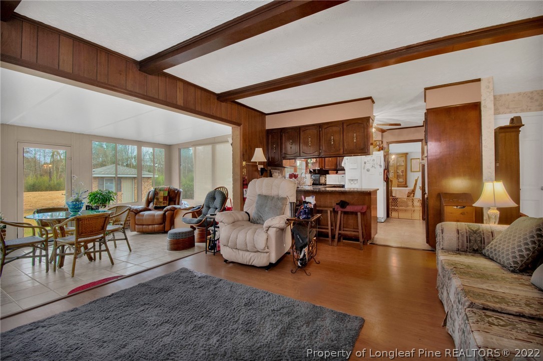 1537 Rice Road Orrum, NC 28369 - Photo 12 of 31 a living room with furniture and a large window