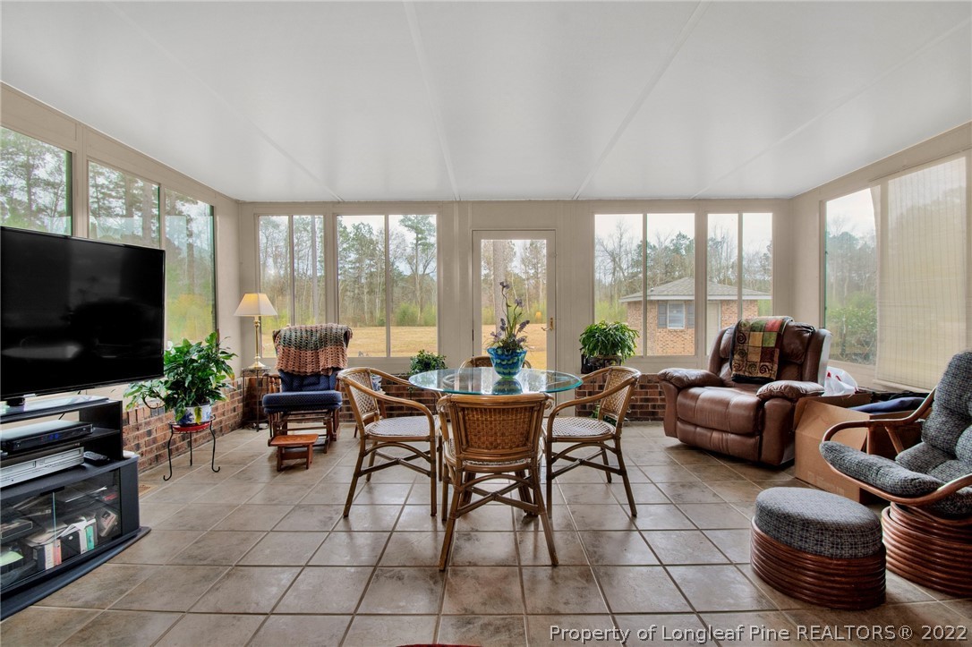 1537 Rice Road Orrum, NC 28369 - Photo 20 of 31 a living room with furniture and a flat screen tv