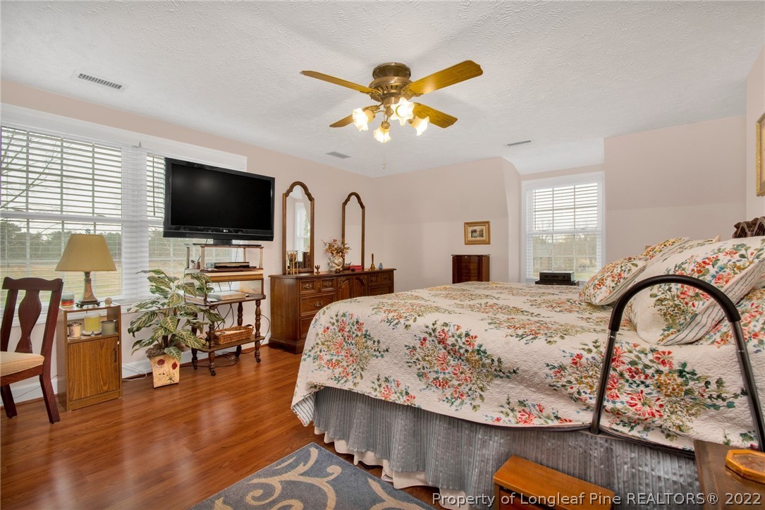 1537 Rice Road Orrum, NC 28369 - Photo 25 of 31 a living room with fireplace furniture and a flat screen tv