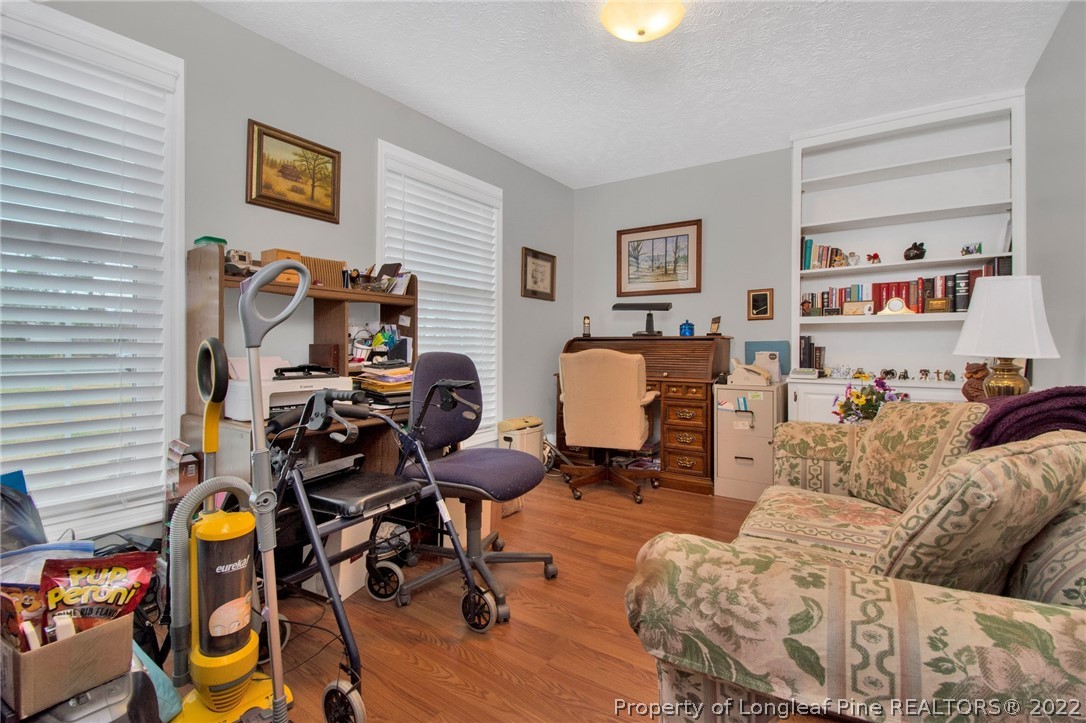 1537 Rice Road Orrum, NC 28369 - Photo 6 of 31 a living room with furniture and a wooden floor