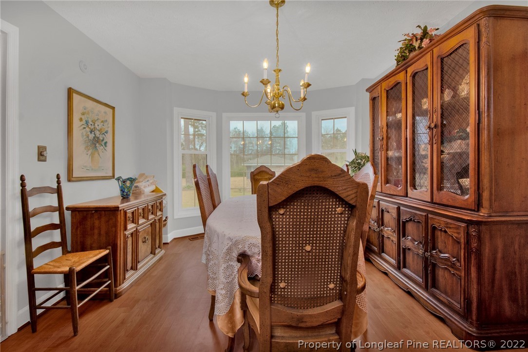 1537 Rice Road Orrum, NC 28369 - Photo 8 of 31 a dining room with furniture window and wooden floor