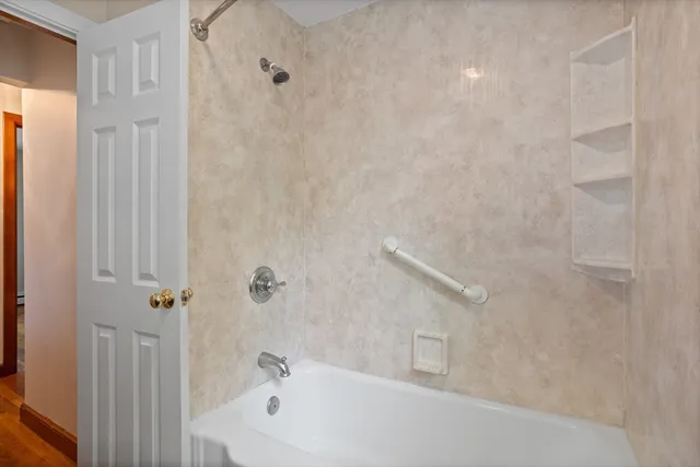 a bathroom with a toilet a sink a mirror and vanity