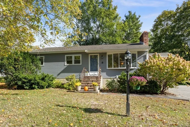 a view of a house with a snow in the yard
