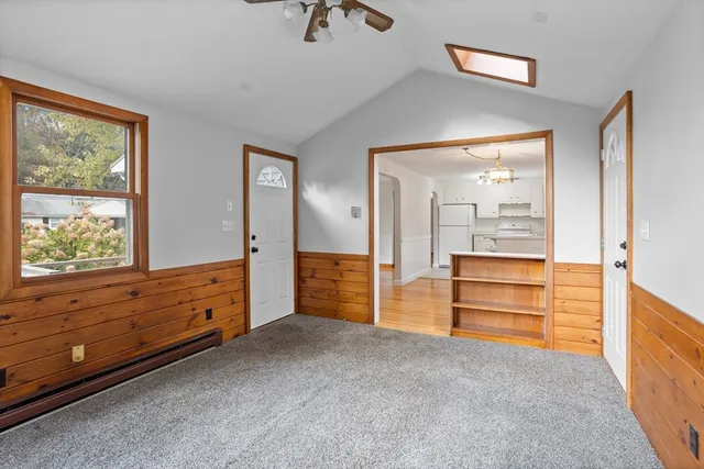 a room with mirror and a window