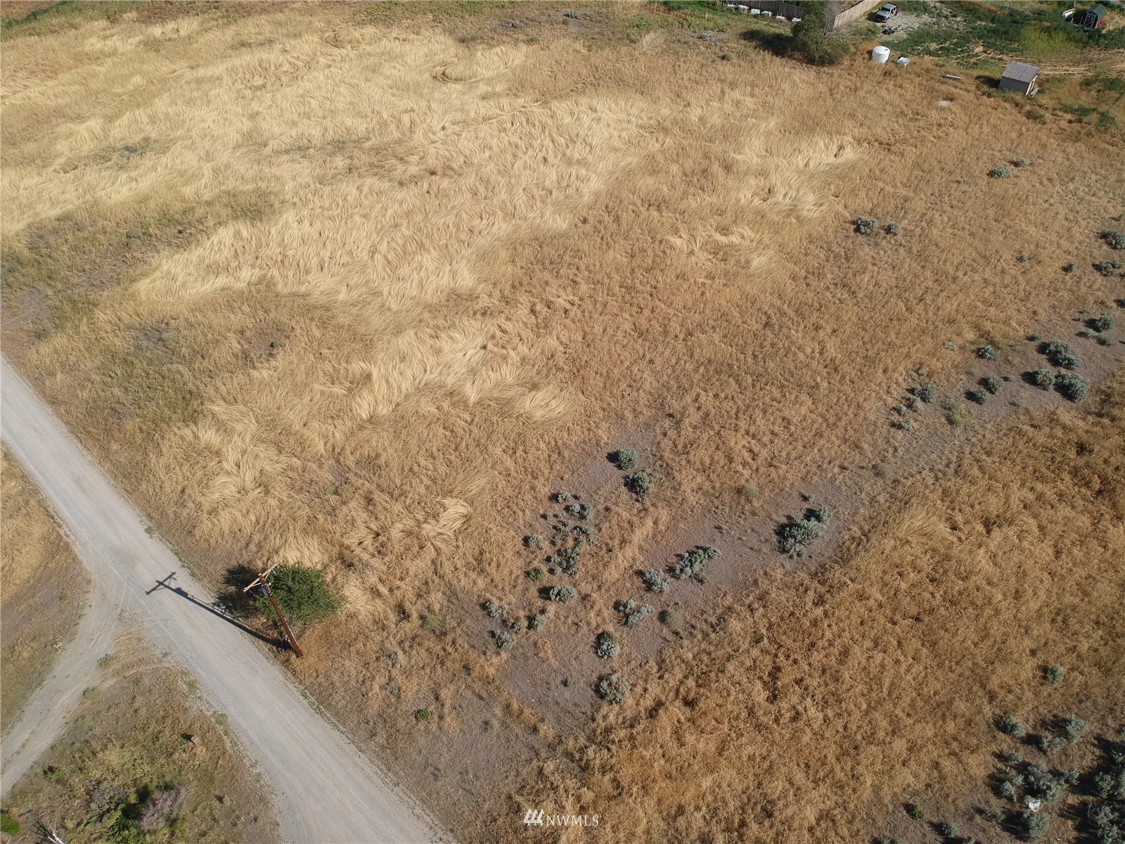 20 Rosewood Lane Riverside, WA 98849 - Photo 11 of 11 a view of a dry yard with wooden fence