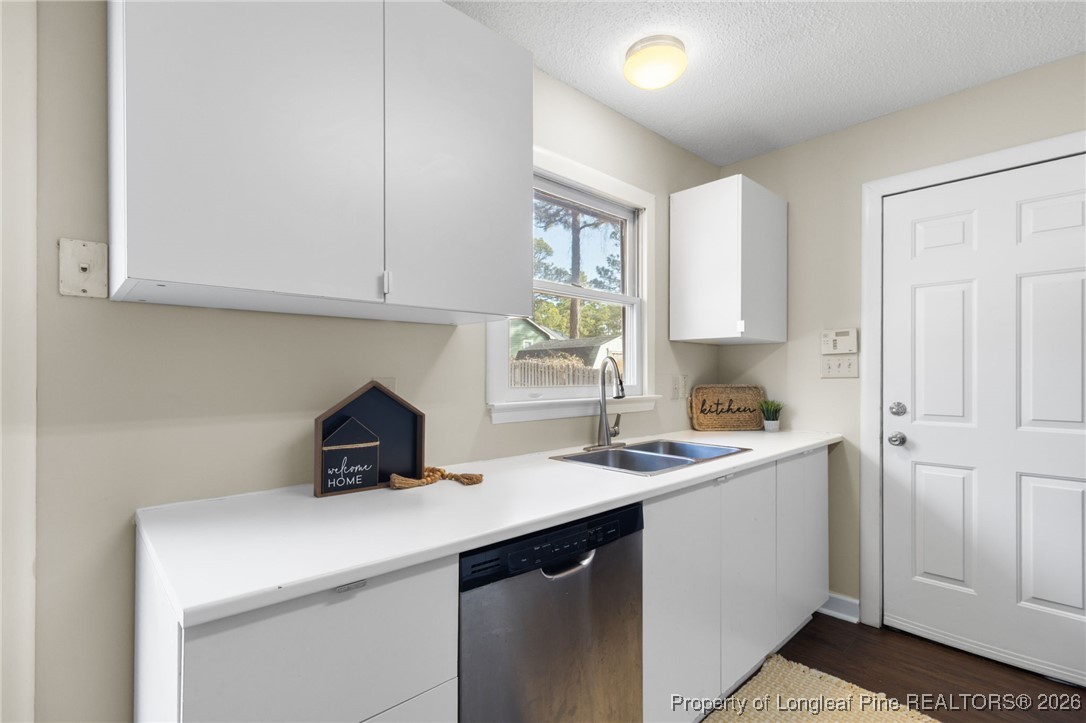 3340 Hunting Bay Drive Spring Lake, NC 28390 - Photo 12 of 28 a kitchen with a sink cabinets and window