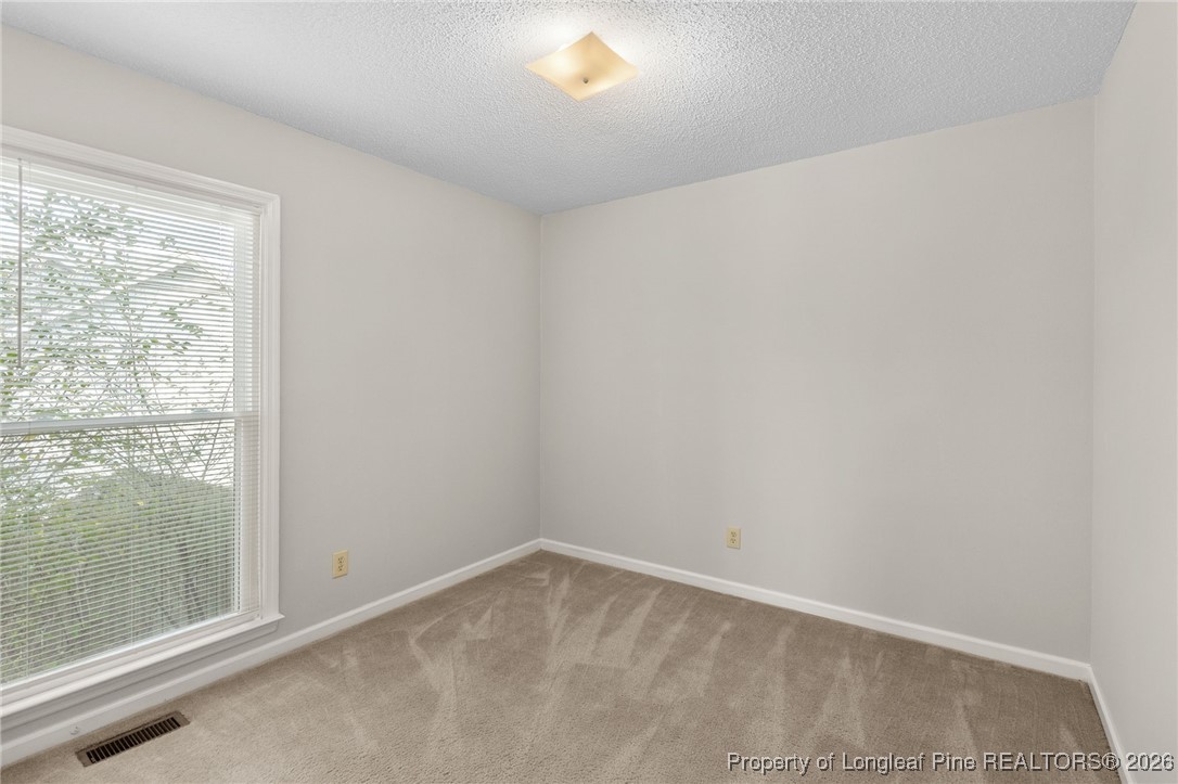 3340 Hunting Bay Drive Spring Lake, NC 28390 - Photo 19 of 28 a view of an empty room with a window