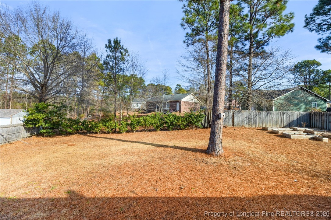 3340 Hunting Bay Drive Spring Lake, NC 28390 - Photo 25 of 28 a street view with tall trees