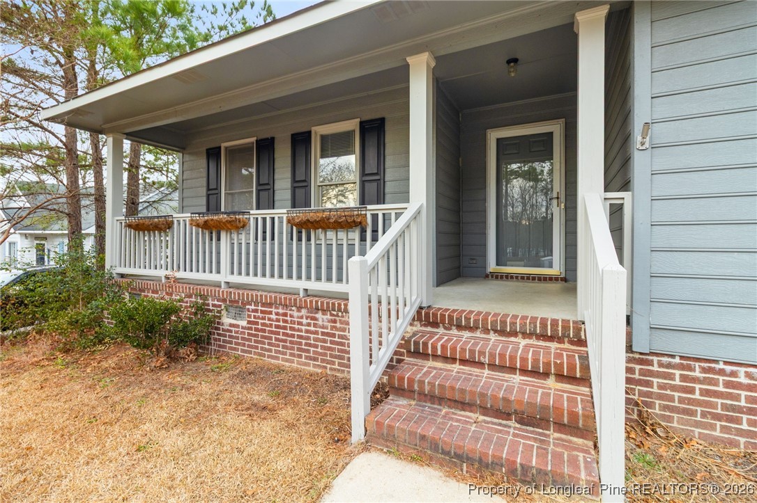 3340 Hunting Bay Drive Spring Lake, NC 28390 - Photo 5 of 28 a porch with a bench