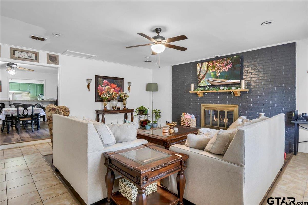 2631 Amy Lane Tyler, TX 75701 - Photo 8 of 26 a living room with furniture and a fireplace