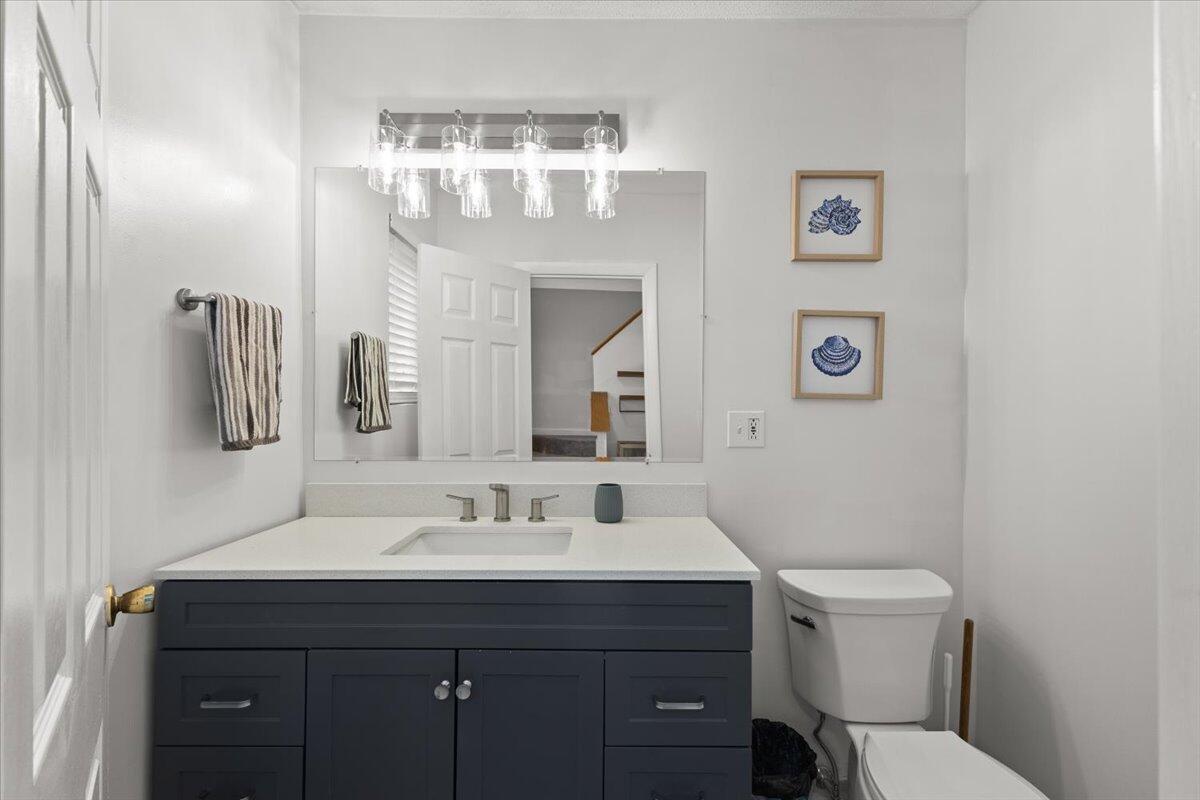 84 Round House Road Bourne, MA 02532 - Photo 20 of 35 a bathroom with a toilet a sink and mirror