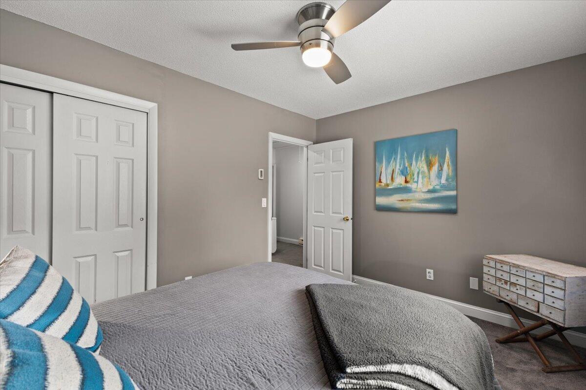 84 Round House Road Bourne, MA 02532 - Photo 23 of 35 a bedroom with a bed and wooden floor