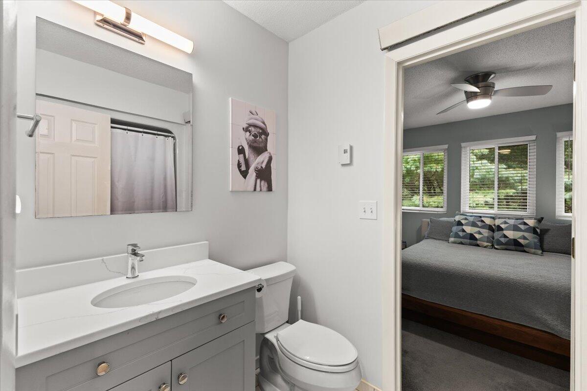 84 Round House Road Bourne, MA 02532 - Photo 25 of 35 a en suite bathroom with a toilet sink and mirror