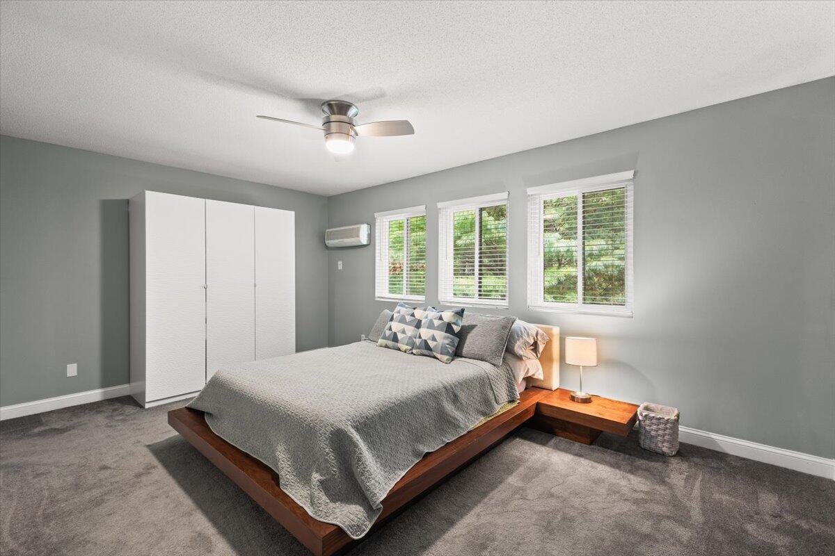 84 Round House Road Bourne, MA 02532 - Photo 27 of 35 a bedroom with a bed and wooden floor