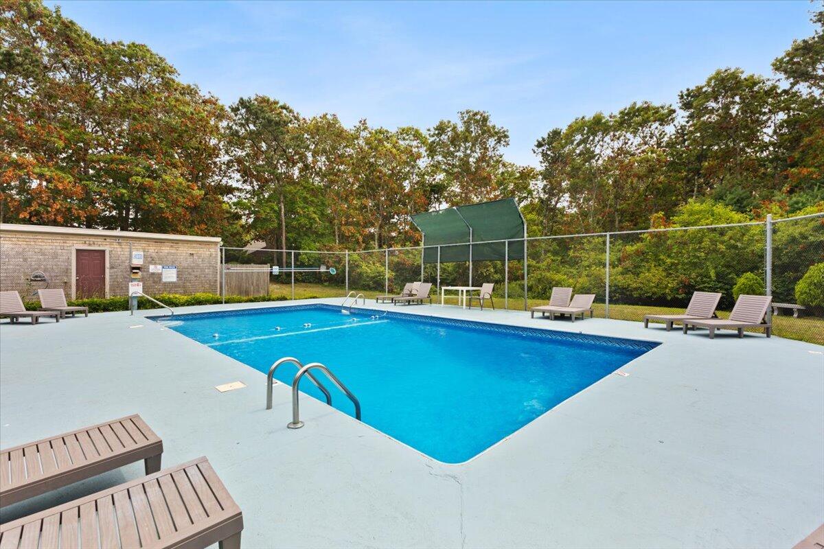 84 Round House Road Bourne, MA 02532 - Photo 33 of 35 a view of a swimming pool with a lounge chair