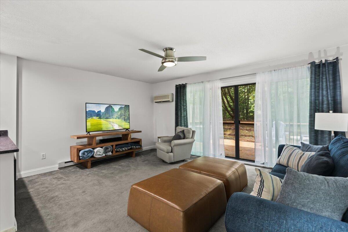84 Round House Road Bourne, MA 02532 - Photo 4 of 35 a living room with furniture and a flat screen tv