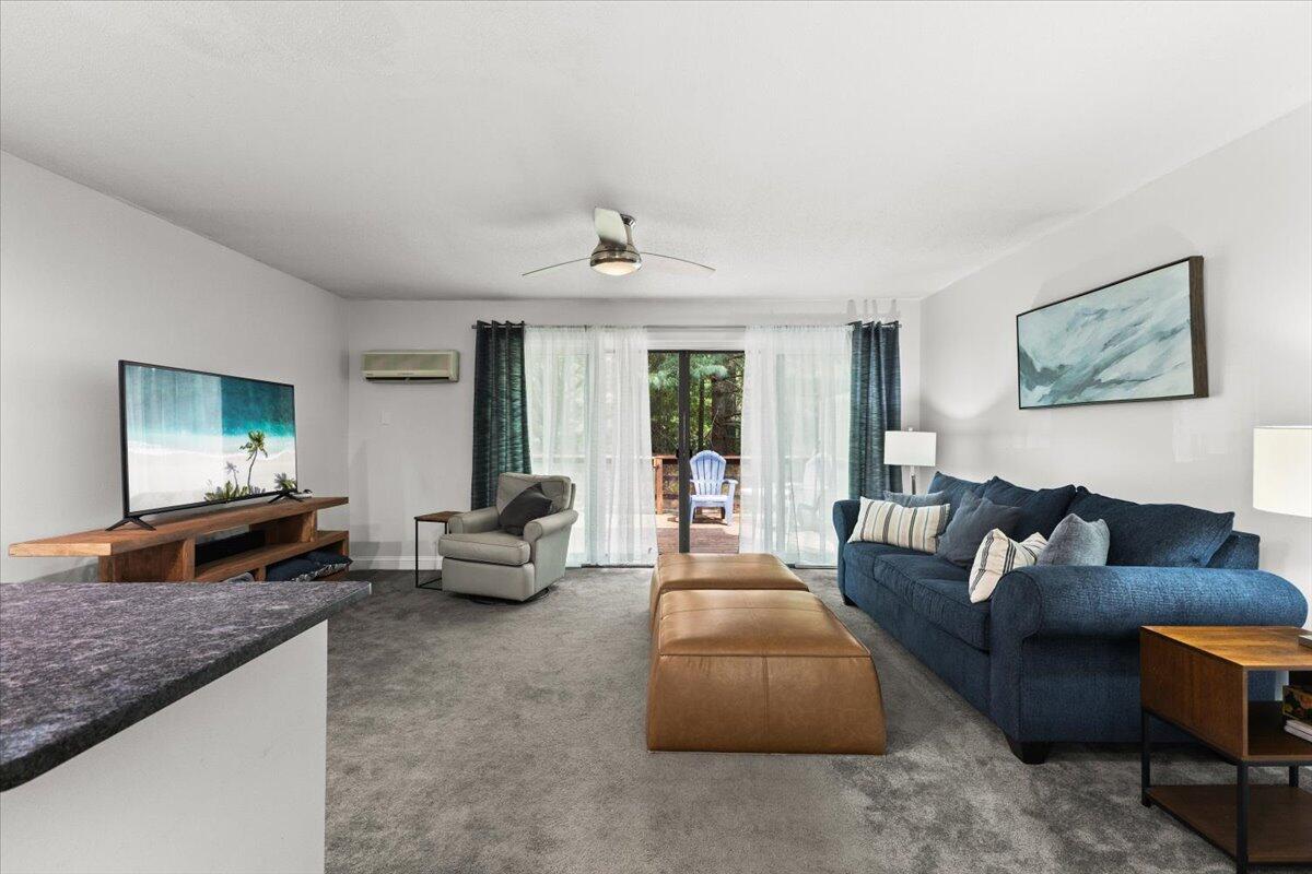 84 Round House Road Bourne, MA 02532 - Photo 5 of 35 a living room with furniture and a large window