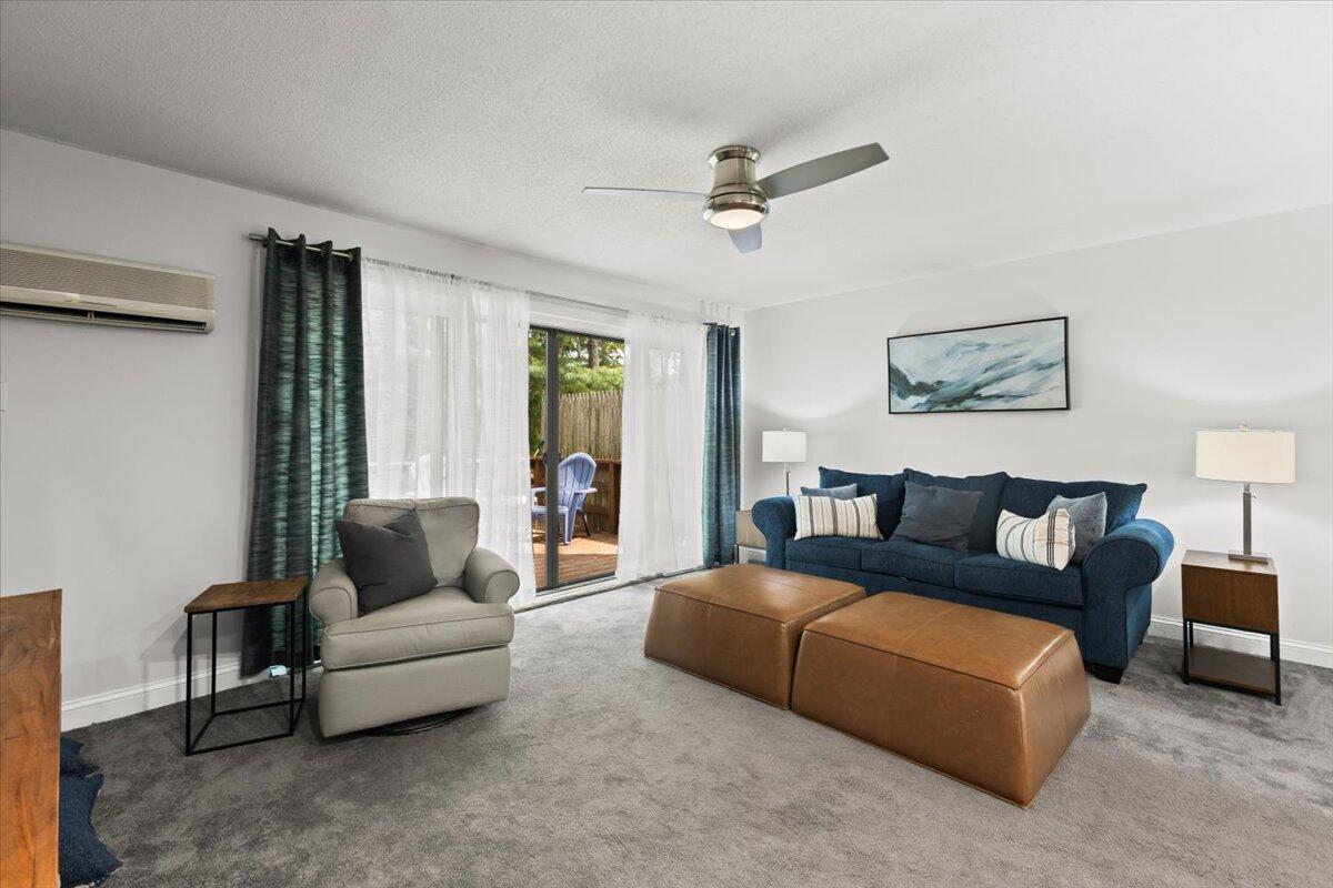 84 Round House Road Bourne, MA 02532 - Photo 6 of 35 a living room with furniture and a large window