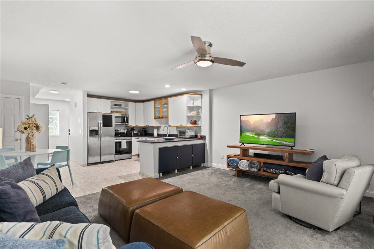 84 Round House Road Bourne, MA 02532 - Photo 8 of 35 a living room with furniture kitchen view and a flat screen tv