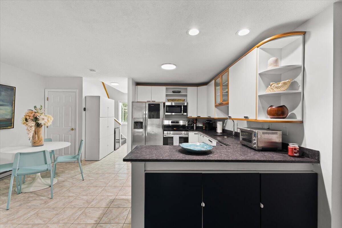 84 Round House Road Bourne, MA 02532 - Photo 10 of 35 a large kitchen with sink and a refrigerator
