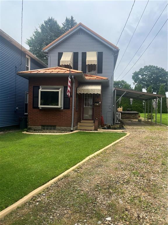 223 Hoeveler Street Springdale, PA 15144 - Photo 14 of 17 a front view of house with yard and green space