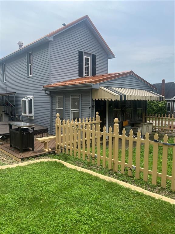 223 Hoeveler Street Springdale, PA 15144 - Photo 17 of 17 a front view of a house with a yard table and chairs