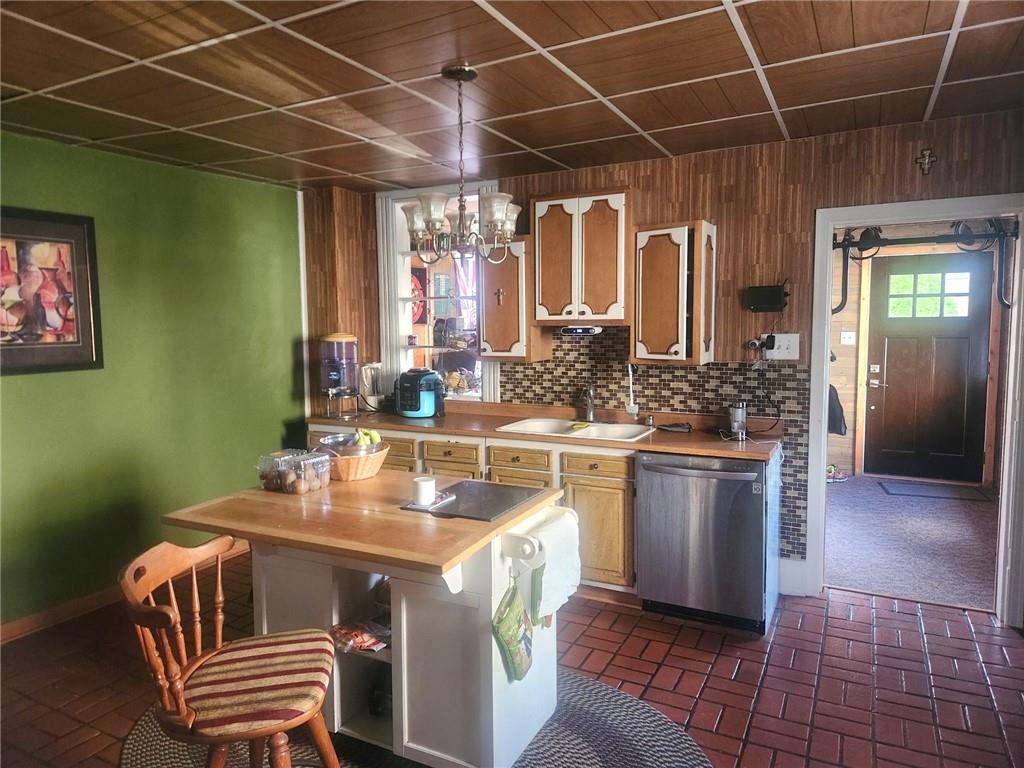 223 Hoeveler Street Springdale, PA 15144 - Photo 4 of 17 a kitchen with a sink a stove and cabinets