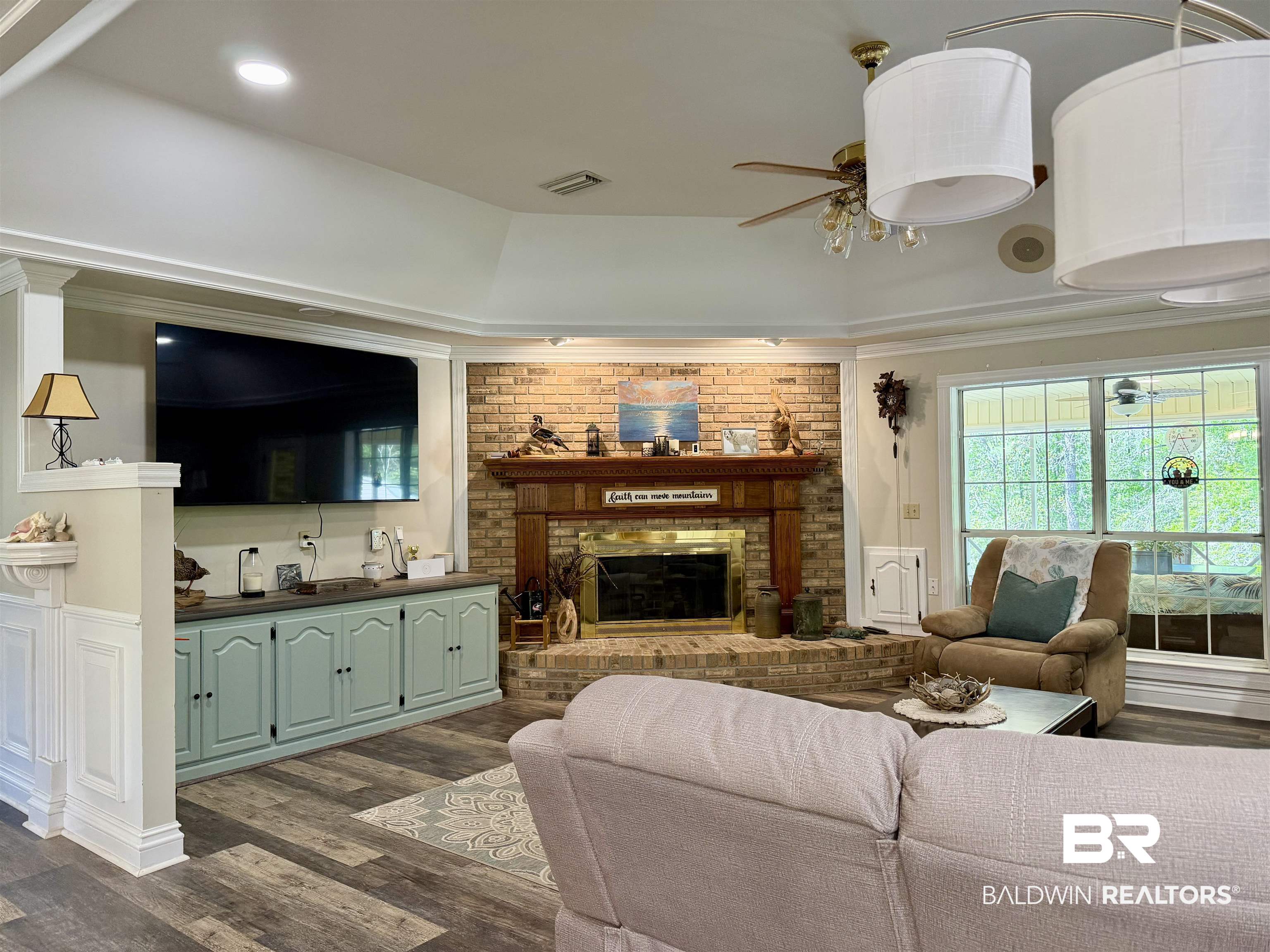 2944 Appleton Road Brewton, AL 36426 - Photo 9 of 65 Living room with dark wood-type flooring, ceiling fan, and a fireplace