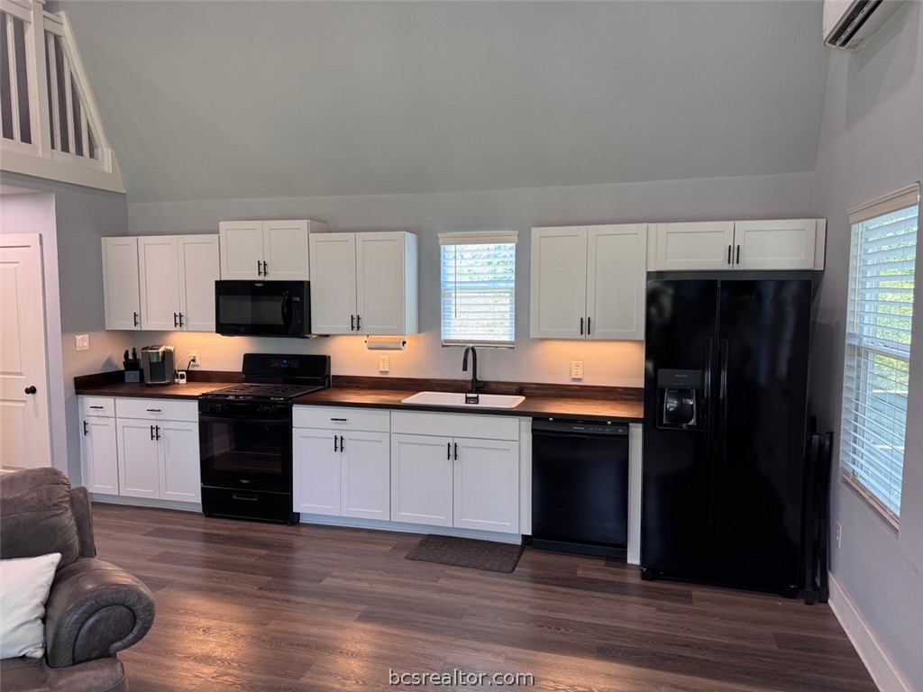 3454 Co Road Marquez, TX 77865 - Photo 20 of 35 a kitchen with granite countertop a refrigerator stove top oven and sink