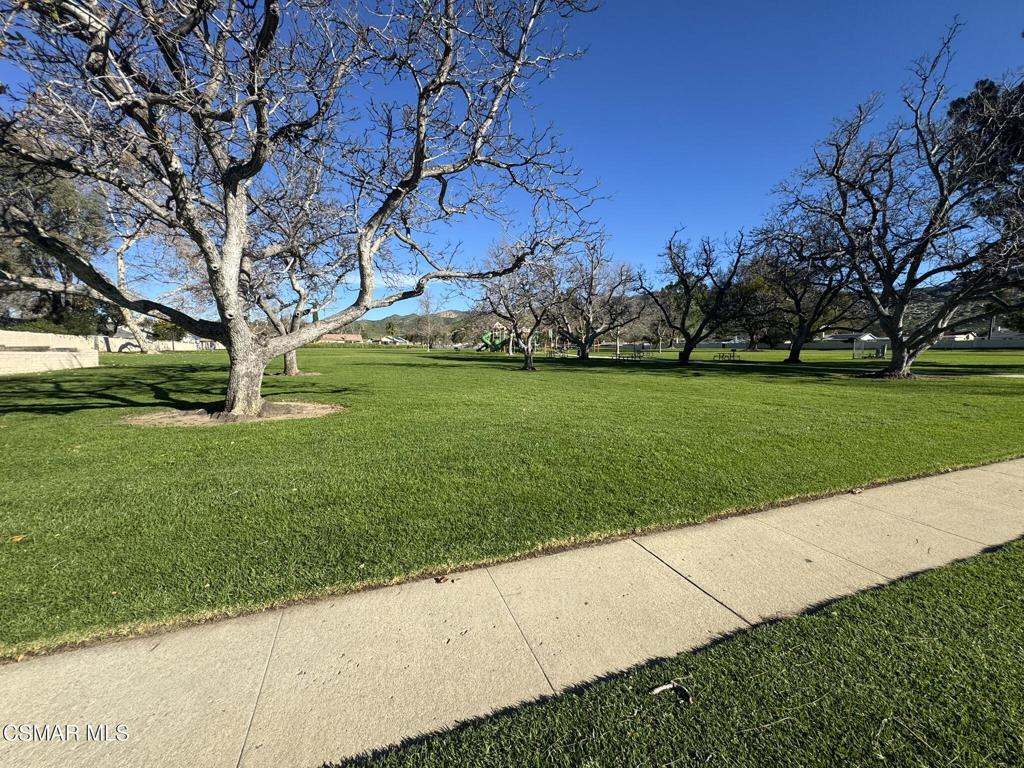 2030 Avenida Placida, Unit 4 Simi Valley, CA 93063 - Photo 17 of 18 a view of a backyard with large trees