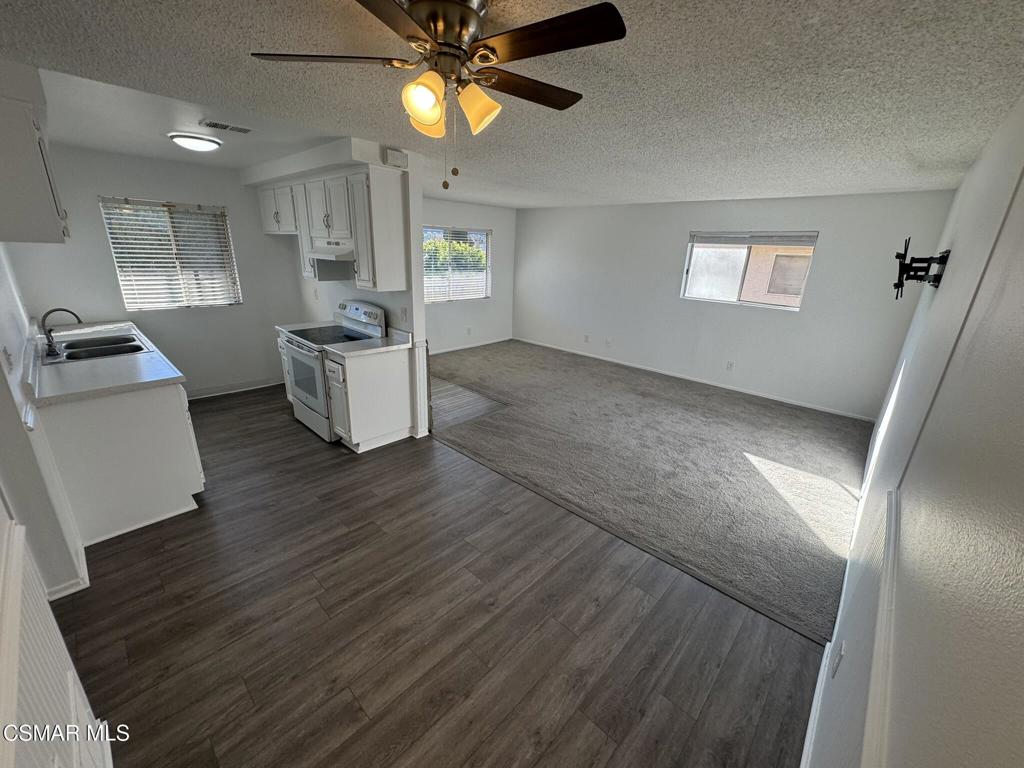 2030 Avenida Placida, Unit 4 Simi Valley, CA 93063 - Photo 3 of 18 wooden floor in an empty room with a window