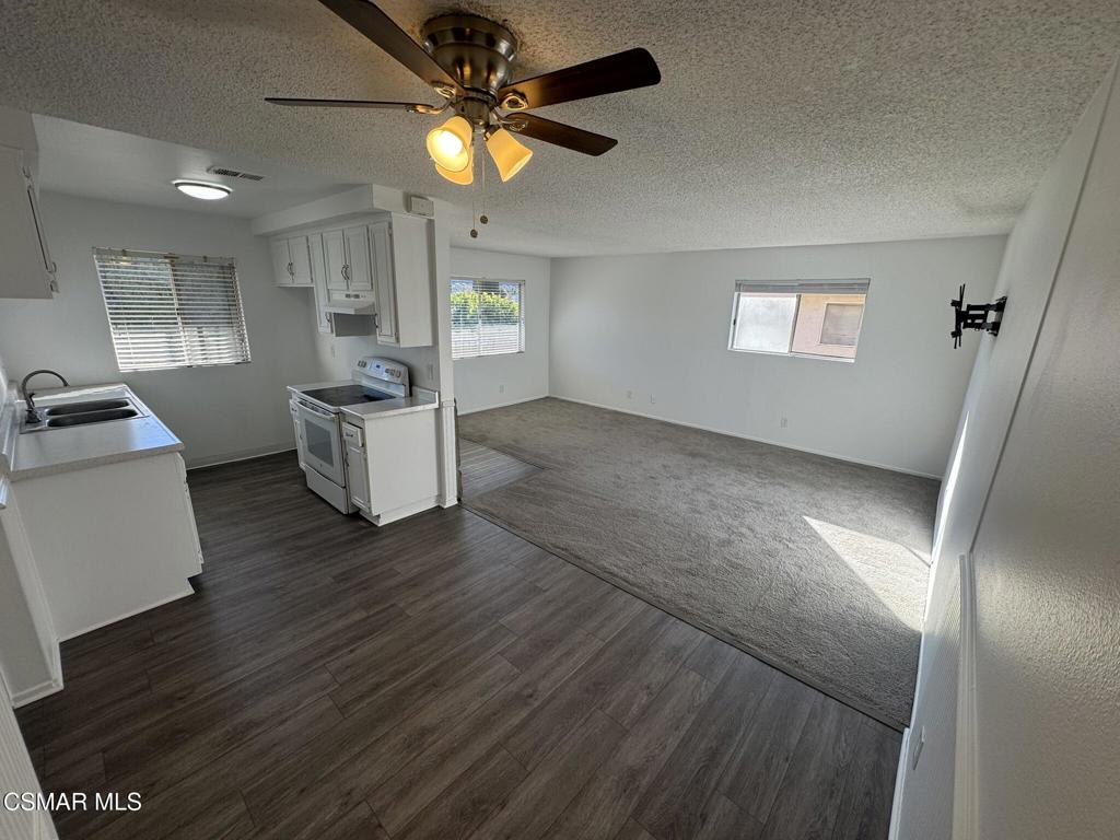 2030 Avenida Placida, Unit 4 Simi Valley, CA 93063 - Photo 4 of 18 wooden floor in an empty room with a window