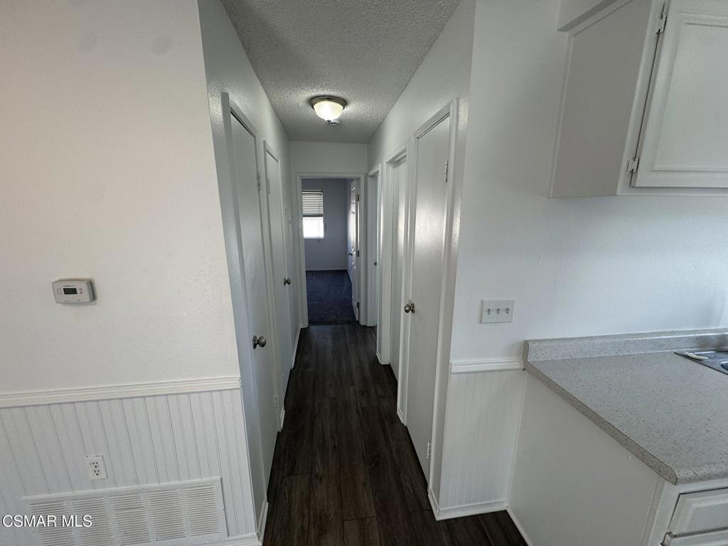 2030 Avenida Placida, Unit 4 Simi Valley, CA 93063 - Photo 6 of 18 a view of a hallway with wooden floor