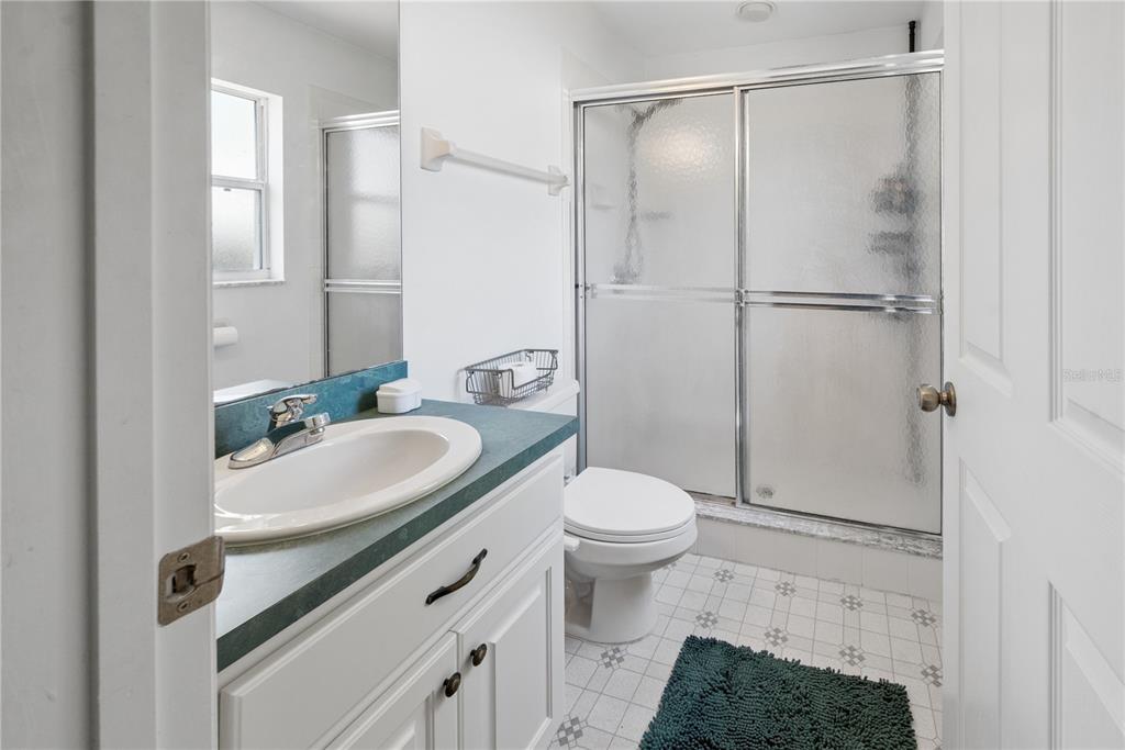 1750 Southwest 15th Street Bell, FL 32619 - Photo 15 of 34 a bathroom with a sink a toilet and shower