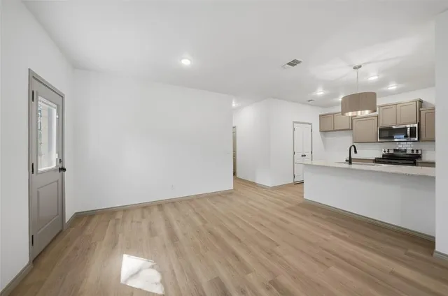 a view of kitchen with wooden floor