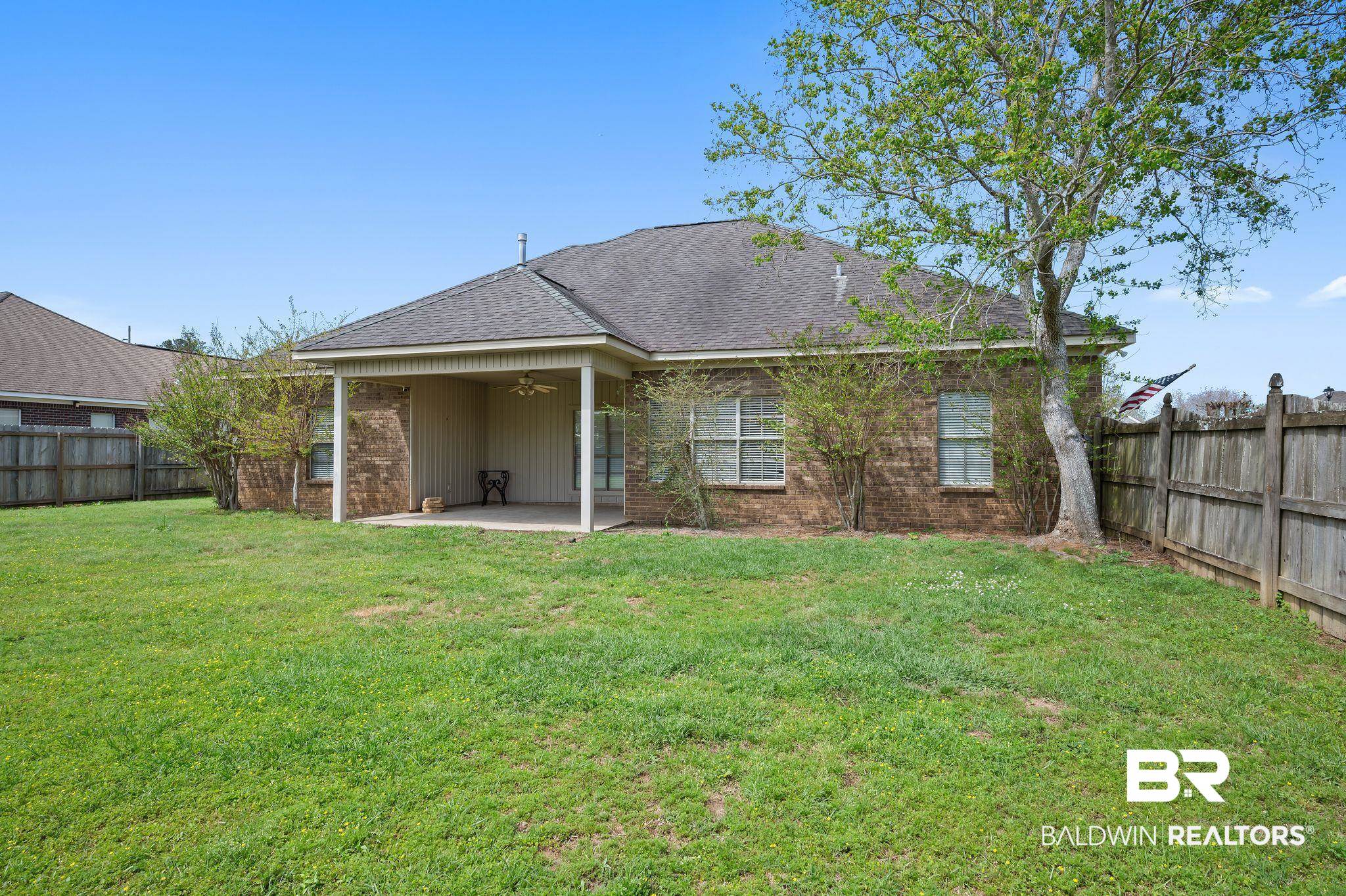 9837 Harmony Ridge Drive Semmes, AL 36575 - Photo 29 of 29 Rear view of property with a patio area, a fenced backyard, a shingled roof, ceiling fan, and a yard
