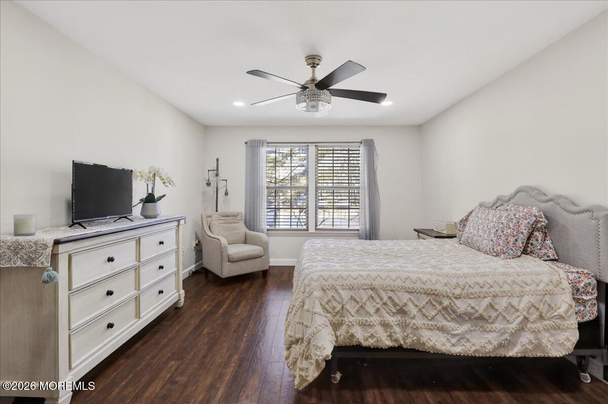 402 Daisy Court Jackson, NJ 08527 - Photo 19 of 44 a bedroom with a bed and wooden floor