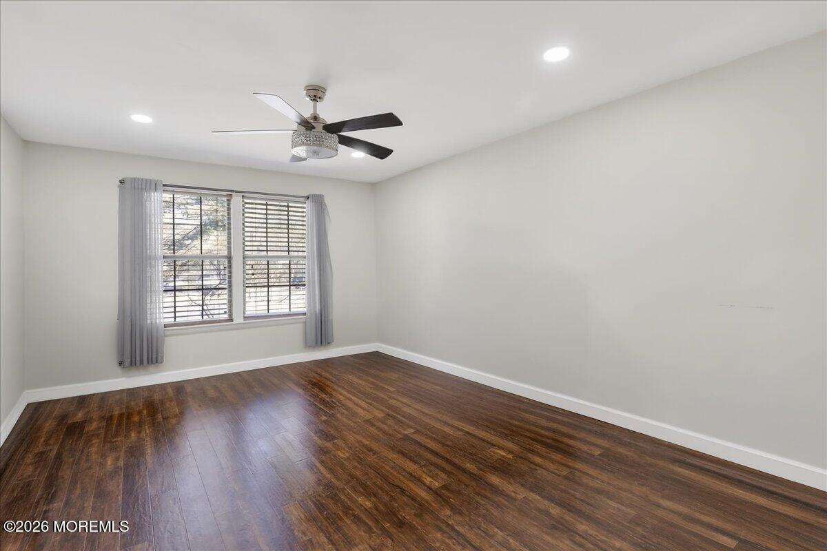 402 Daisy Court Jackson, NJ 08527 - Photo 21 of 44 wooden floor in an empty room with a window