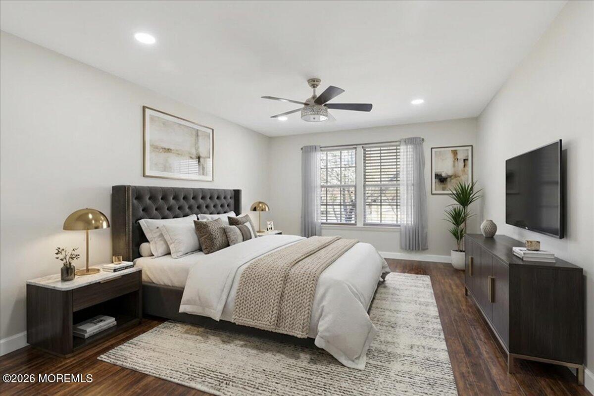 402 Daisy Court Jackson, NJ 08527 - Photo 22 of 44 a bedroom with a large bed and a flat screen tv