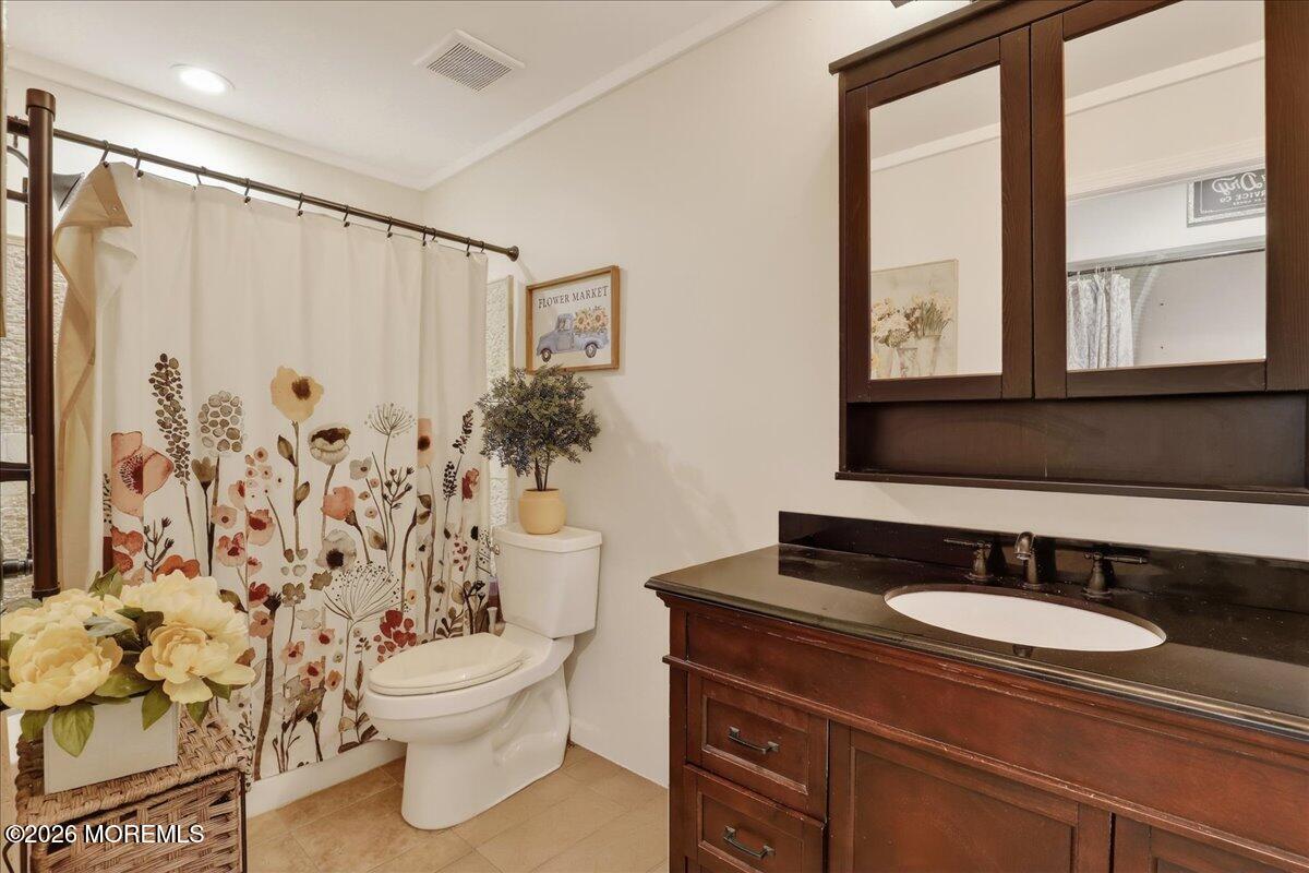 402 Daisy Court Jackson, NJ 08527 - Photo 23 of 44 a bathroom with a sink toilet and shower