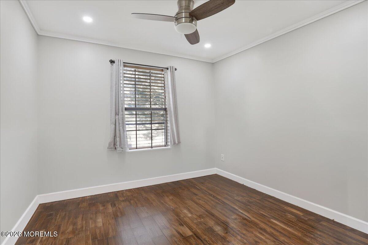 402 Daisy Court Jackson, NJ 08527 - Photo 25 of 44 an empty room with wooden floor and windows