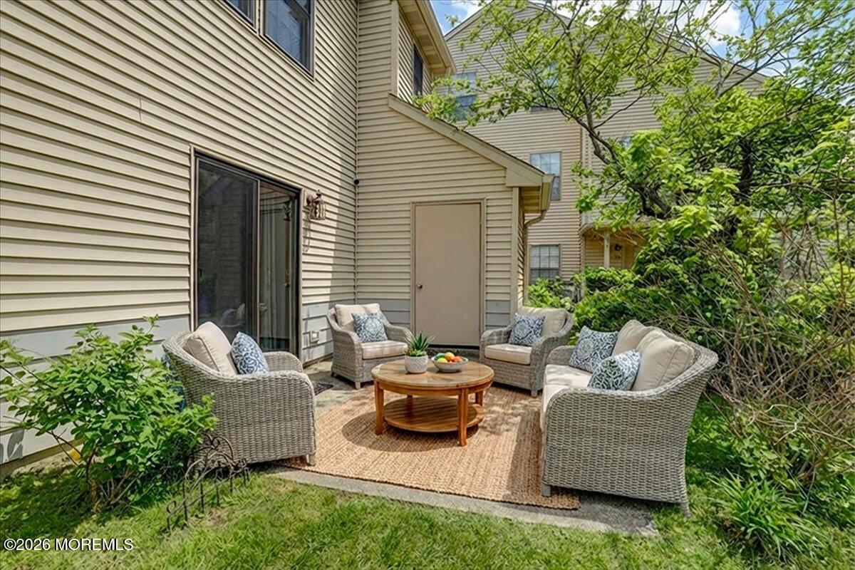 402 Daisy Court Jackson, NJ 08527 - Photo 30 of 44 a patio with couches and a potted plant