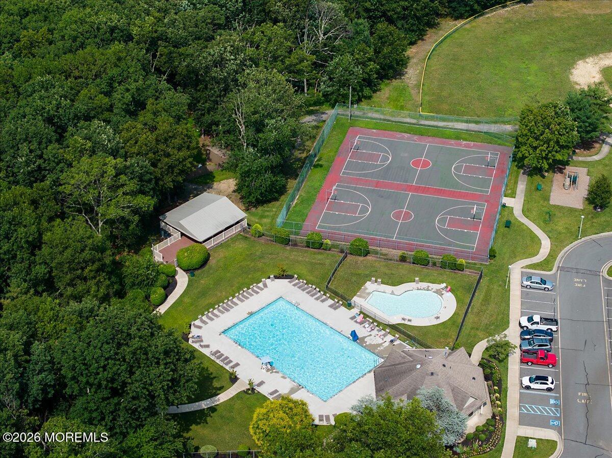 402 Daisy Court Jackson, NJ 08527 - Photo 33 of 44 an aerial view of a chairs and table in the patio