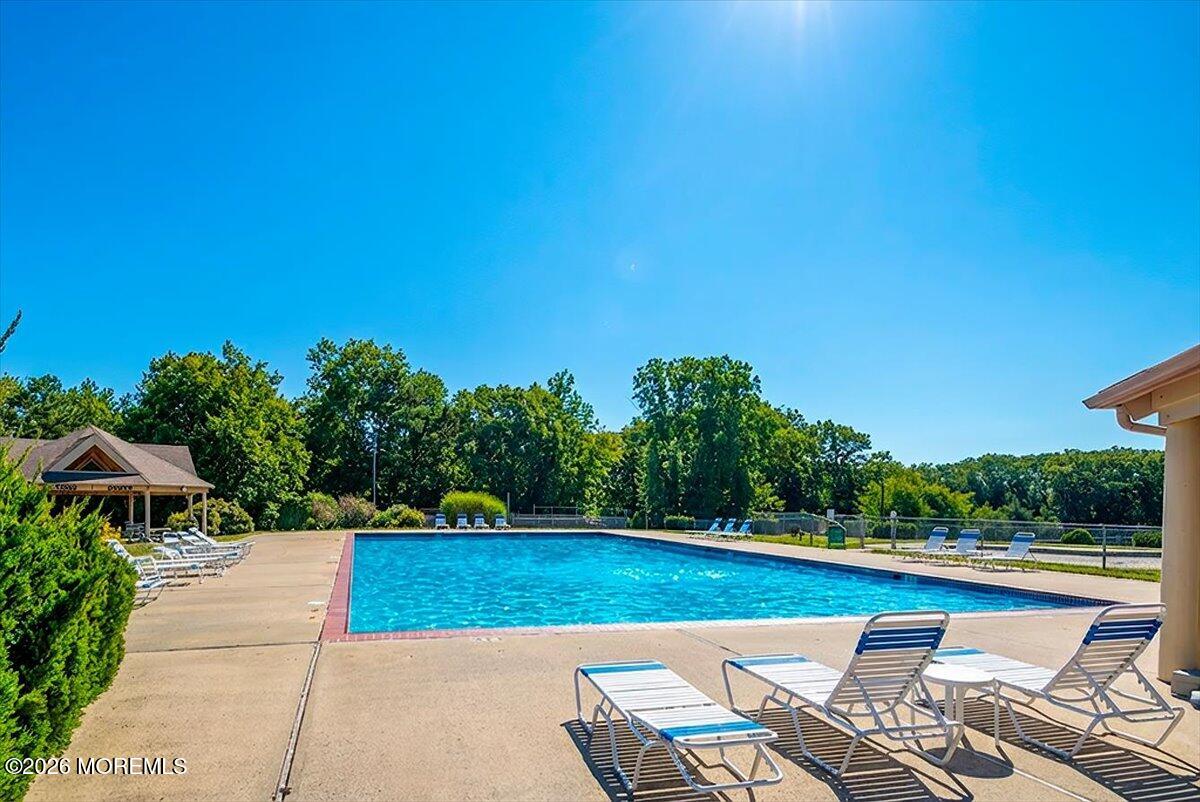 402 Daisy Court Jackson, NJ 08527 - Photo 34 of 44 a view of swimming pool with seating space