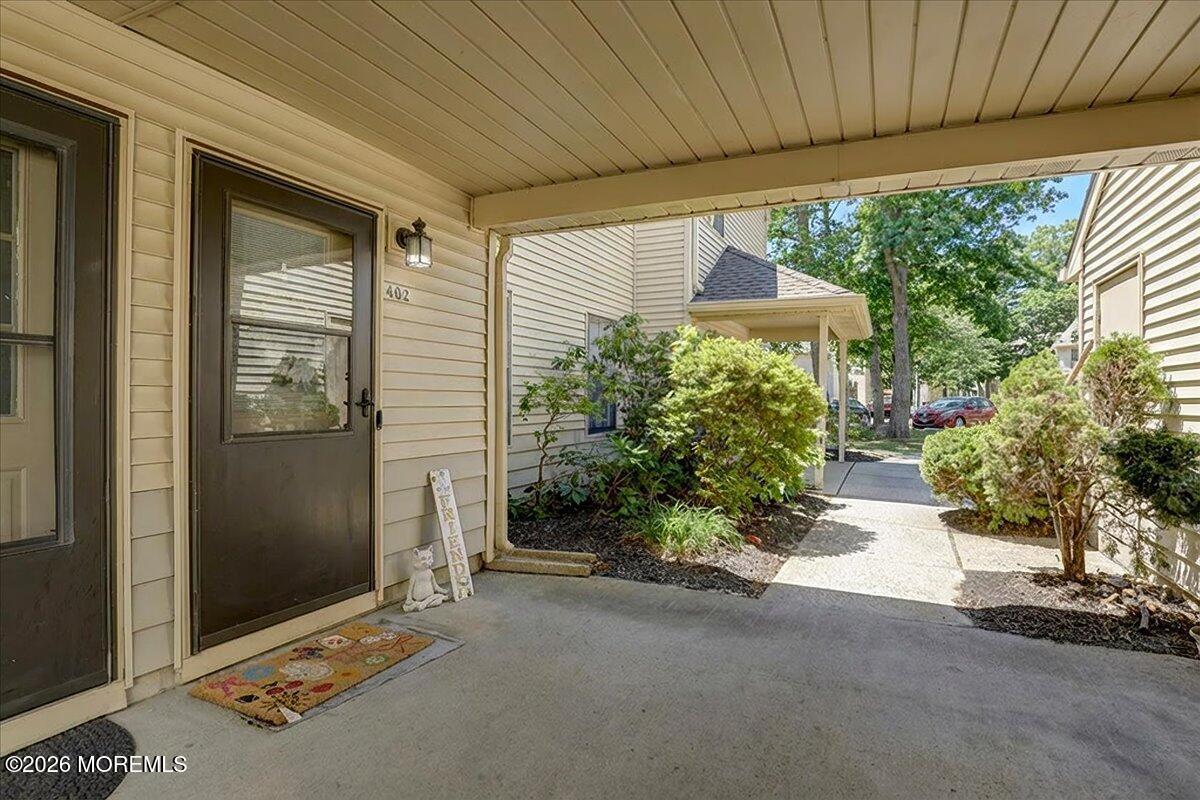 402 Daisy Court Jackson, NJ 08527 - Photo 6 of 44 a couple of potted plants in front of a door