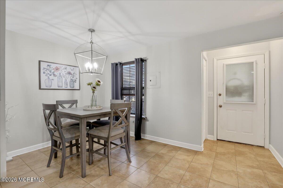 402 Daisy Court Jackson, NJ 08527 - Photo 8 of 44 a view of a dining room with furniture