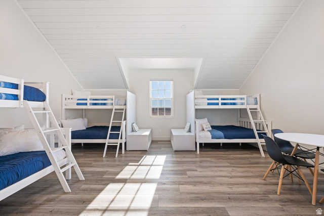 4281 Canterbury Road Hurricane, UT 84737 - Photo 15 of 24 Spacious room featuring wood-finish flooring, white shiplap ceiling, and multiple bunk beds